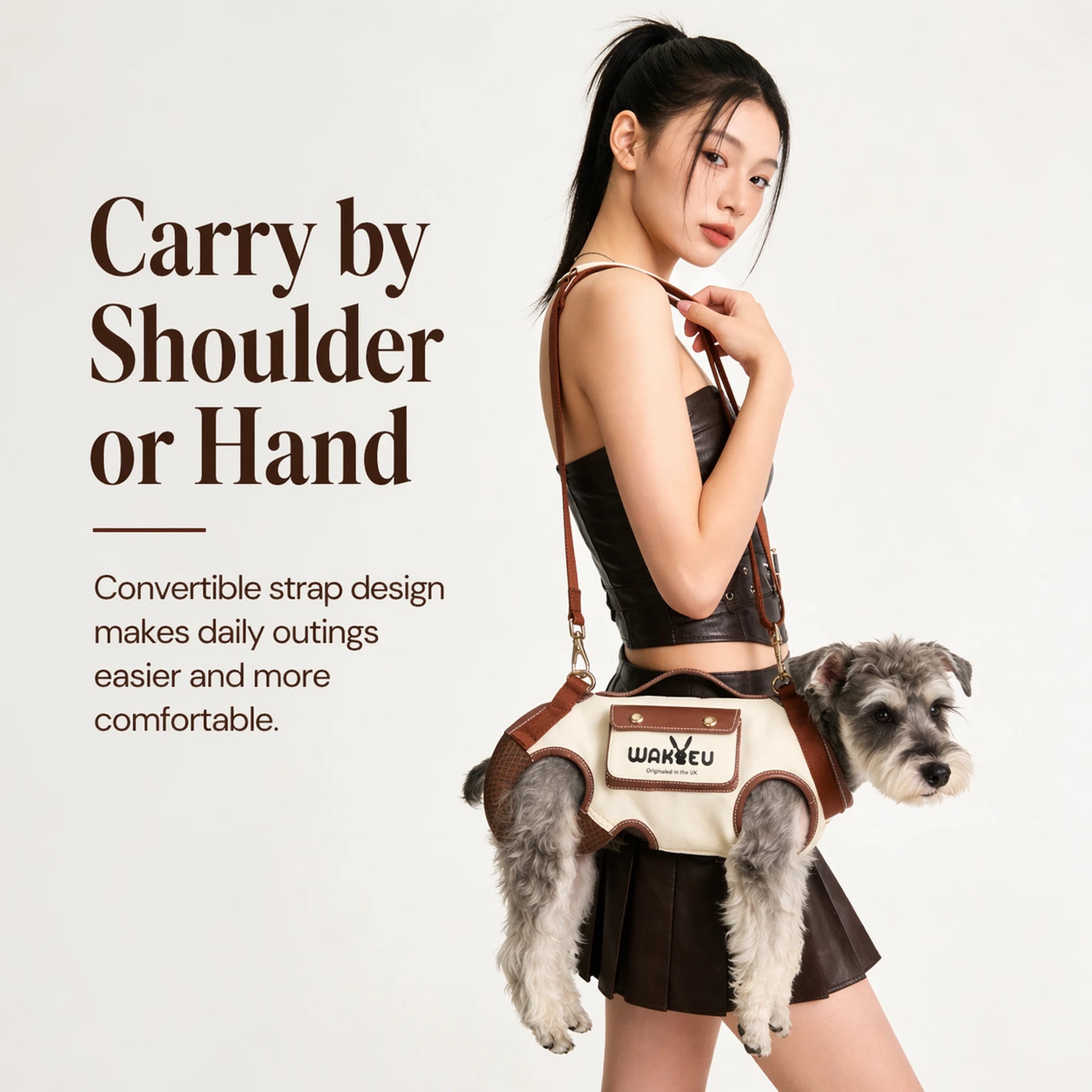 Woman wearing the cream dog carrier harness crossbody with a small schnauzer inside