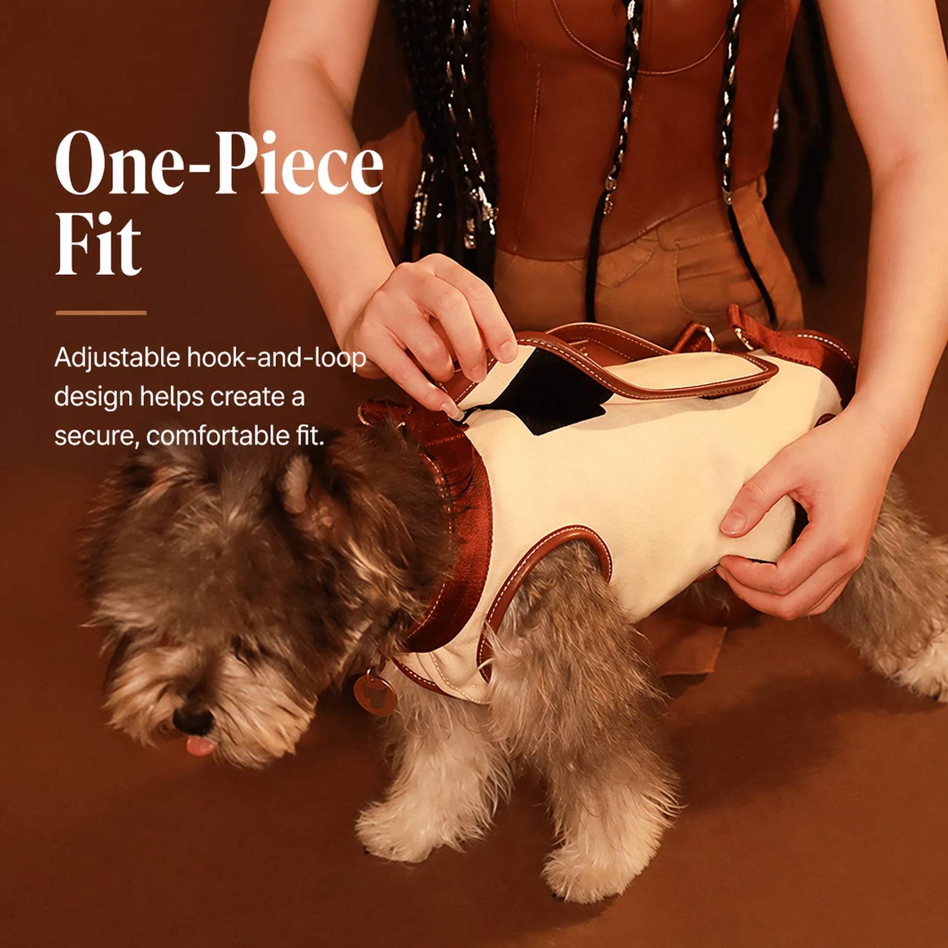 Adjustable hook-and-loop back closure on the cream dog carrier harness for a secure fit
