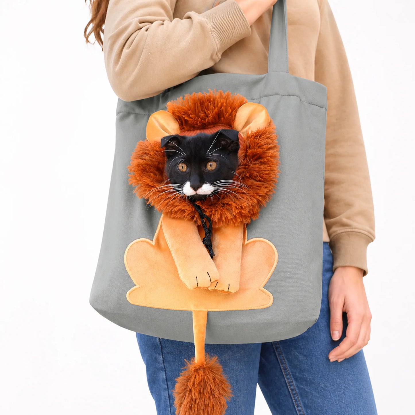 Closeup of cat through lion mane opening of canvas carrier tote