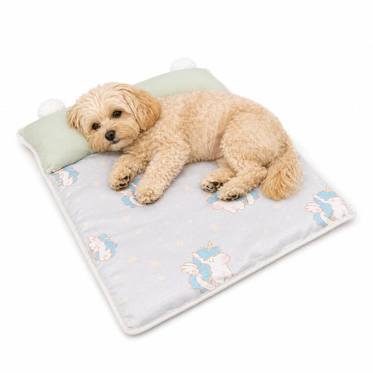 Maltipoo dog resting on green unicorn cooling pet sleeping mat with raised pillow