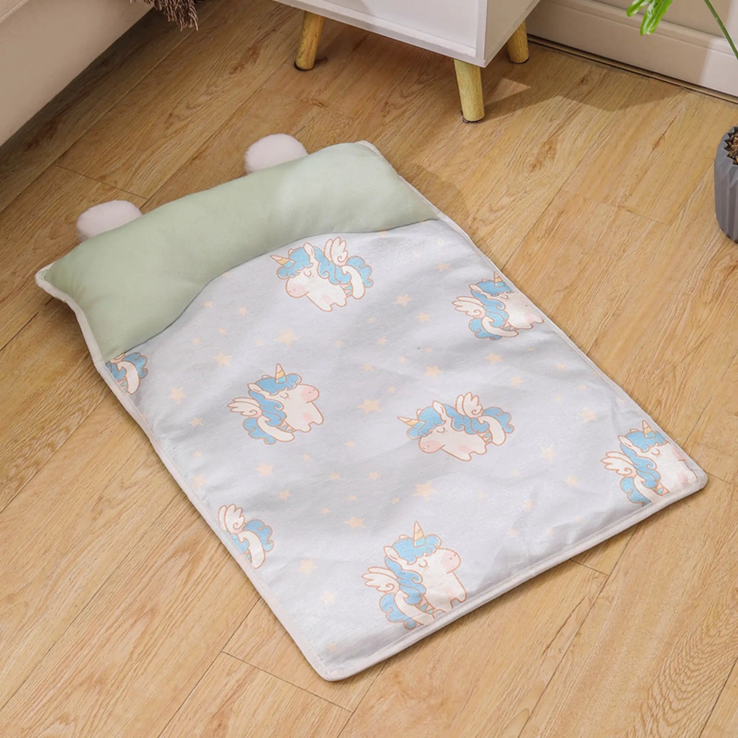 Green Unicorn print cooling pet mat with sage-green bolster pillow