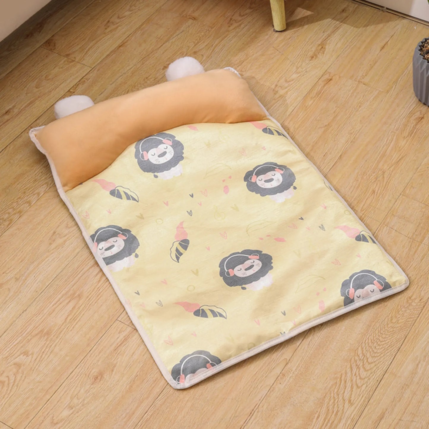 Yellow Lion print cooling pet mat with orange bolster pillow