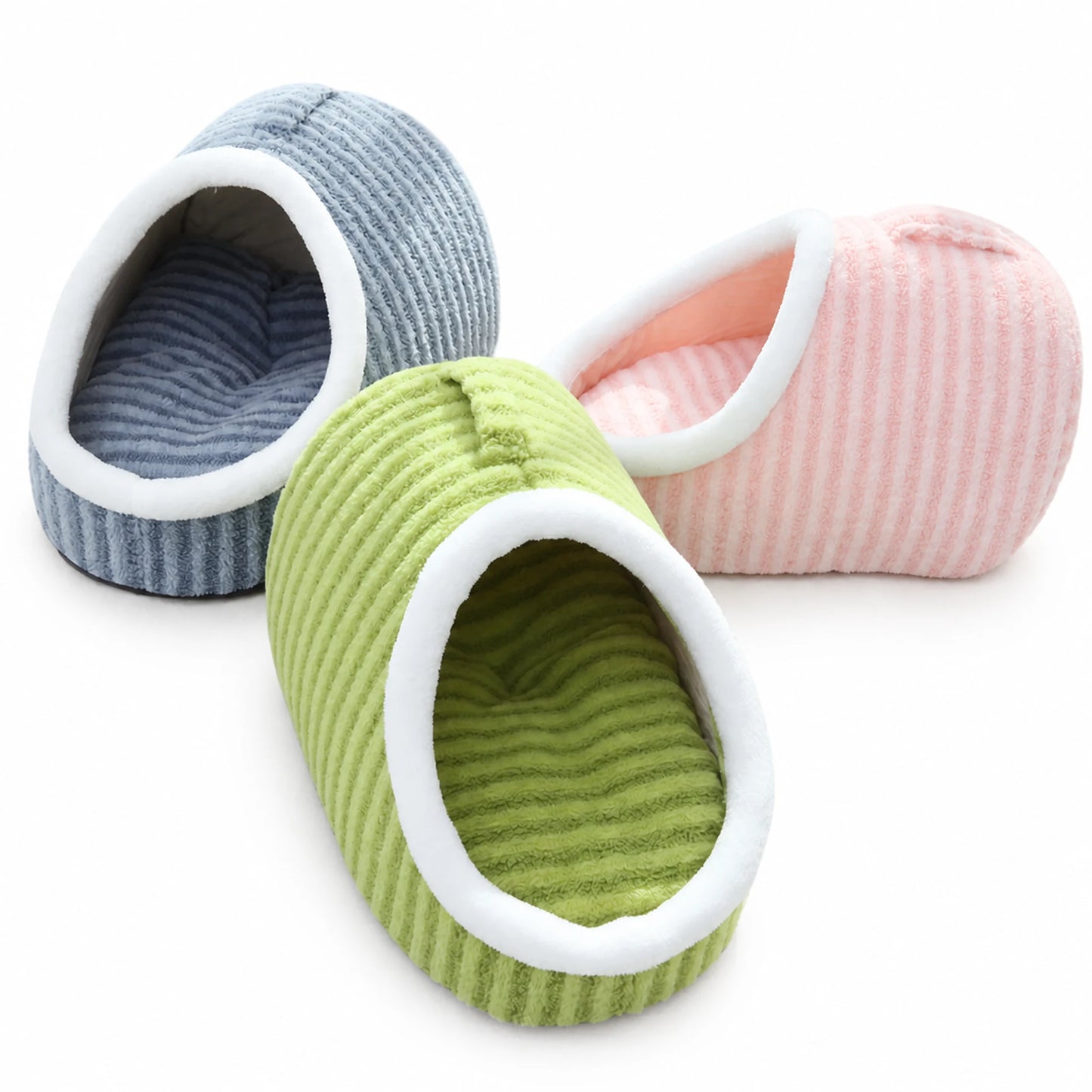Slipper-shape plush pet cave bed in blue, pink, and green colorways grouped together