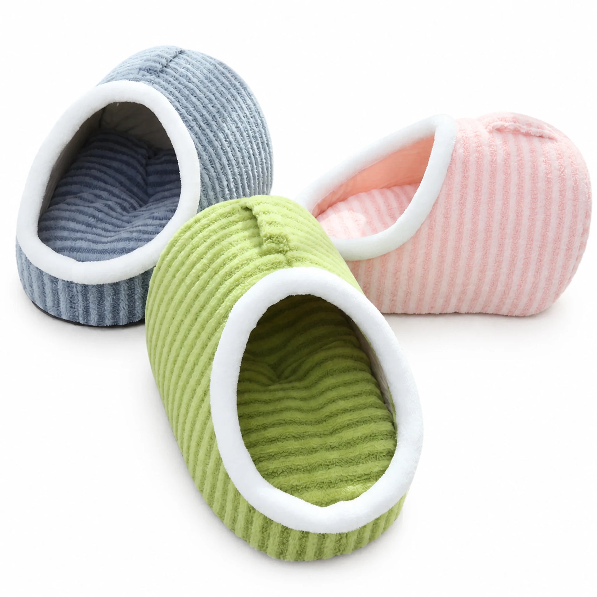 Slipper-shape plush pet cave bed in blue, pink, and green colorways grouped together