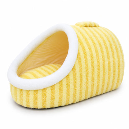 Pastel-yellow slipper-shape plush pet cave bed with white plush trim and carry handle