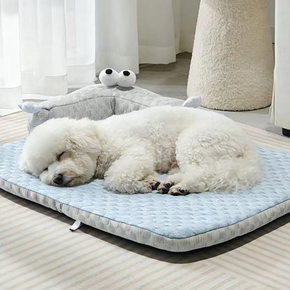 Bichon dog sleeping closeup on cooling pet mat showing waffle fabric texture